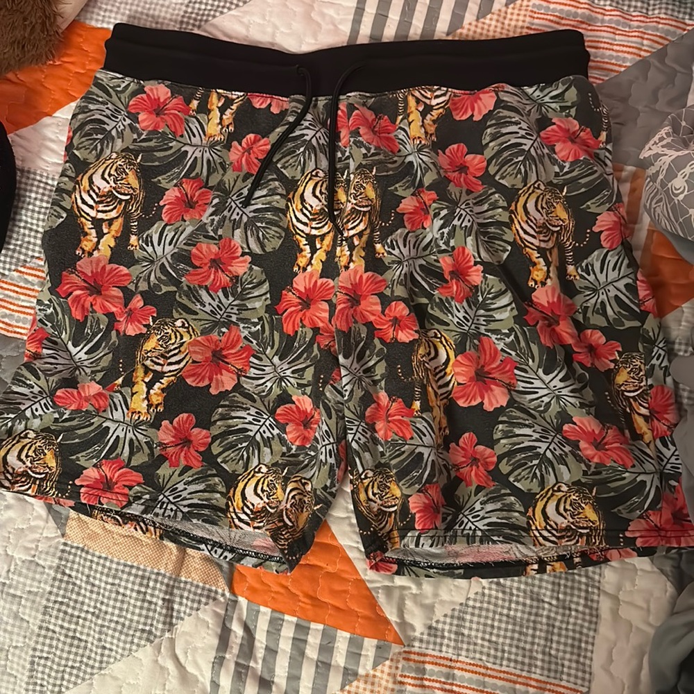 shorts, has flowers tigers and plants